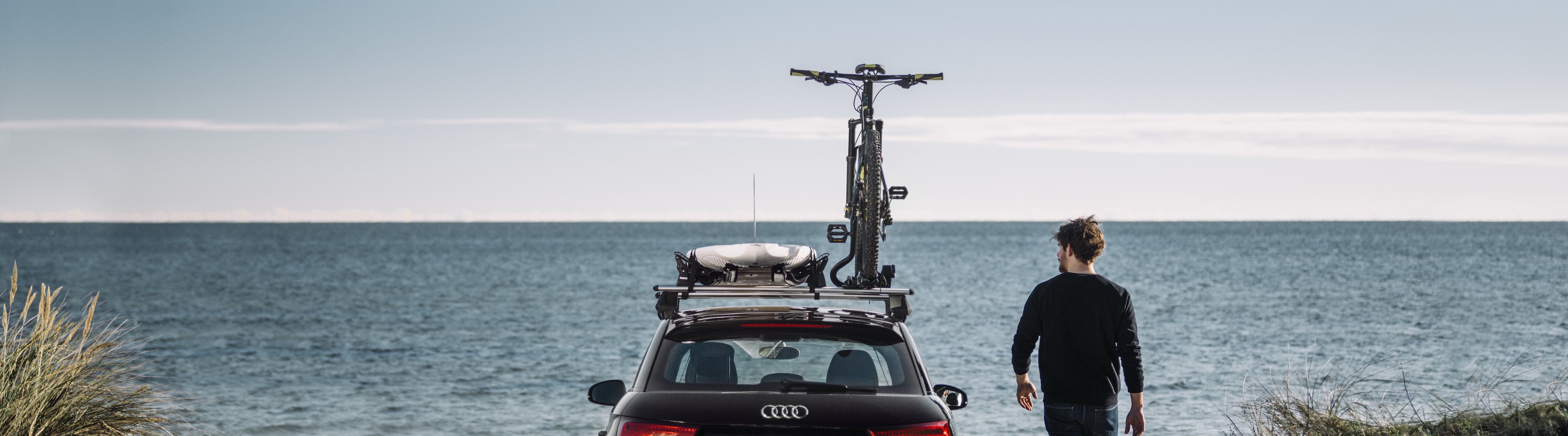 Thule Evo WingBar roof rack with Thule DockGrip kayak carrier and ProRide cycle carrier