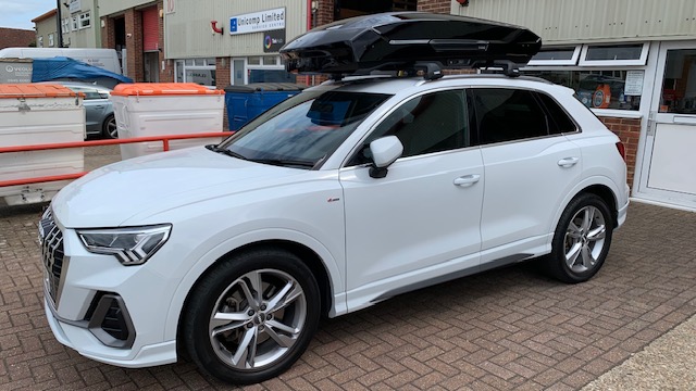 Audi Q3 with Thule Motion 3 XL Glossy Black roof box and Thule WingBar Edge Black roof bars